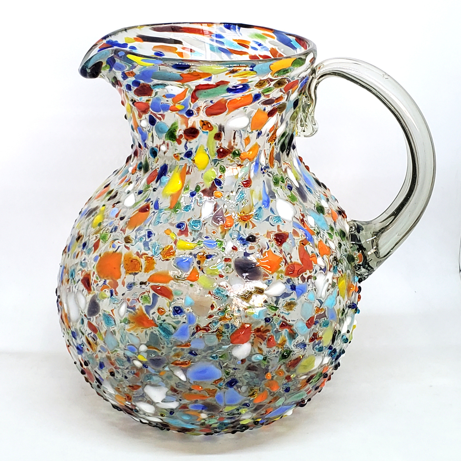 MEXICAN GLASSWARE / Confetti Rocks 120 oz Large Bola Pitcher / Confetti rocks appear to rest inside this modern blown glass pitcher that will make your table setting shine. Each pitcher is adorned with hundreds of tiny multicolor glass particles, giving it a one-of-a-kind look and feel.